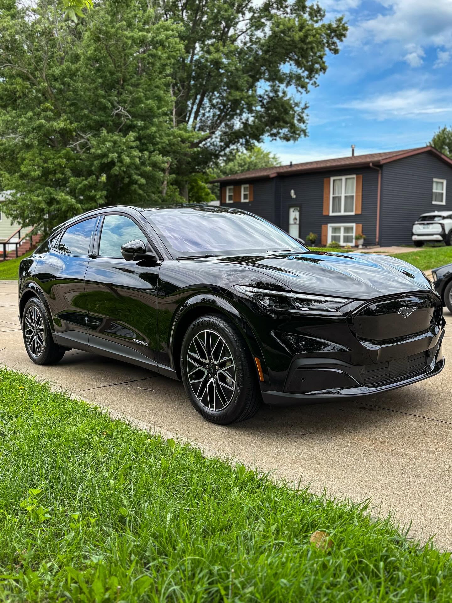 Gloss black Ford Mustang Mach-E detailed in a Galesburg driveway