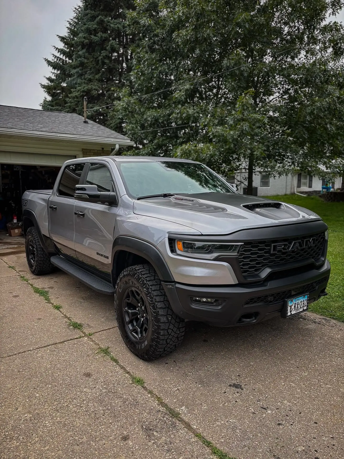Silver Ram RHO truck ceramic coated and polished in a driveway